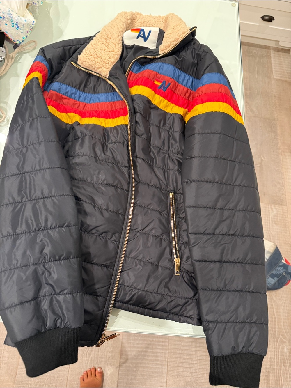 Aviator Nation Black Puffer Jacket with Red, Yellow & Blue Stripes